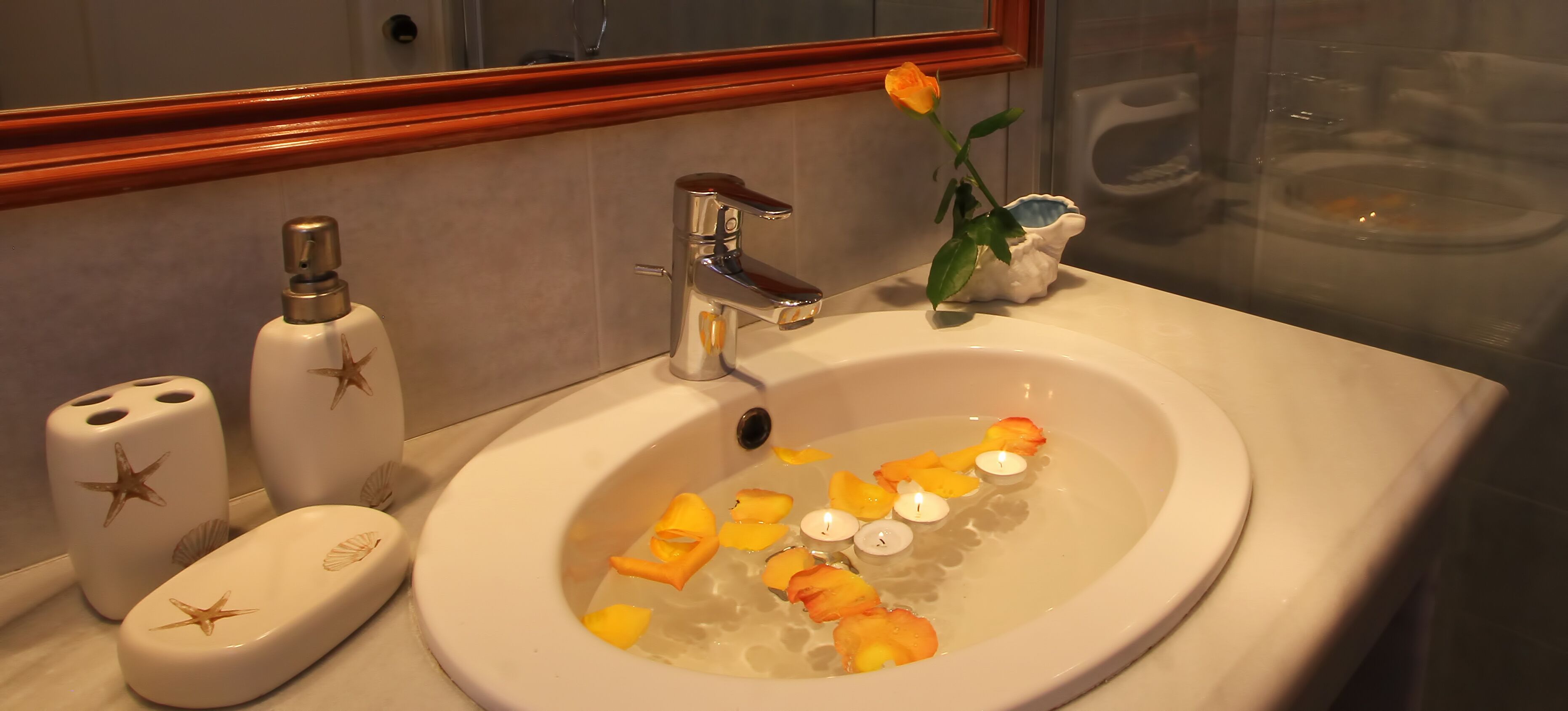 junior studio suite, 1 king bed, beach view, beachfront | bathroom | free toiletries, hair dryer, slippers, towels