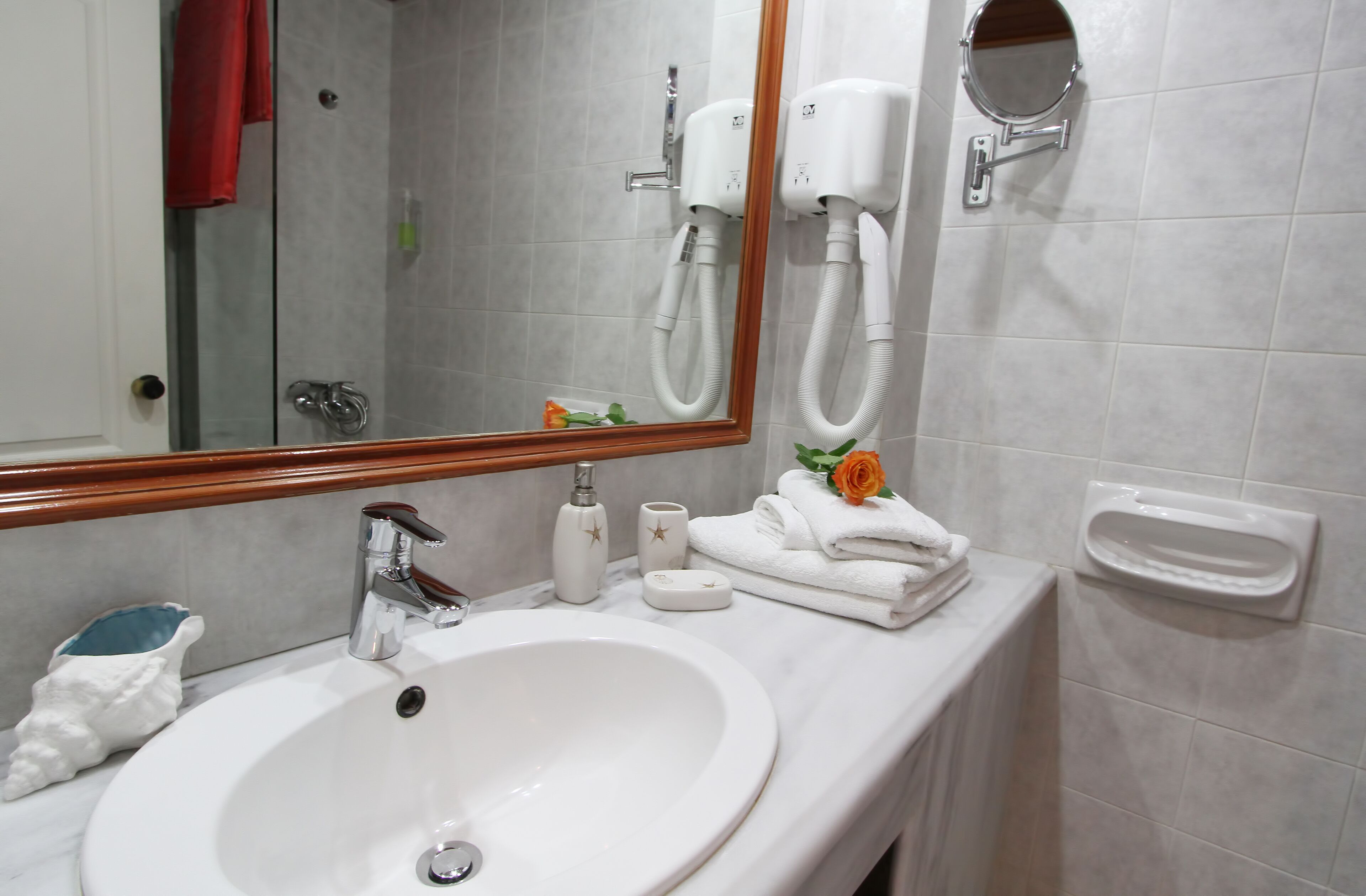 deluxe studio, 1 king bed, beach view, beachfront | bathroom | free toiletries, hair dryer, slippers, towels