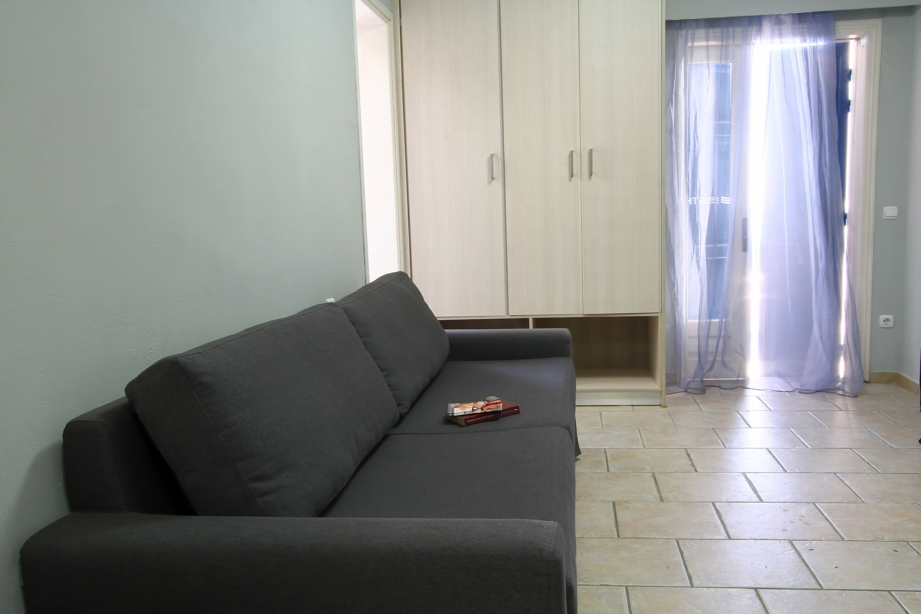 family apartment, 1 bedroom, beach view | living room | 28-inch lcd tv with cable channels, tv