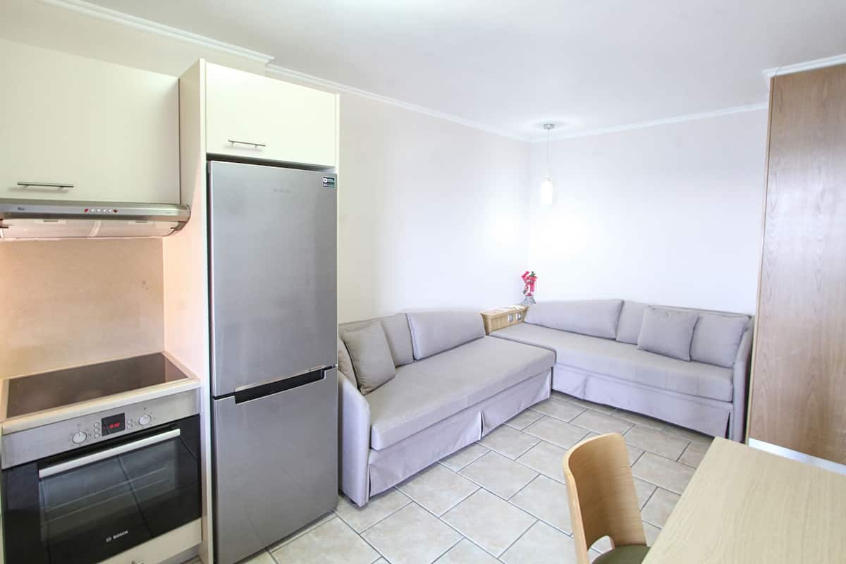 family apartment, 1 bedroom, beach view | living room | 28-inch lcd tv with cable channels, tv