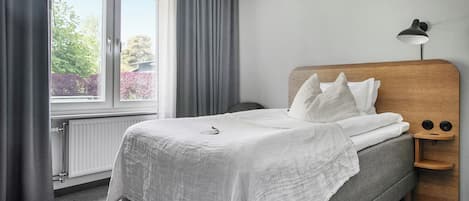 Habitación individual | Ropa de cama hipoalergénica, cortinas blackout y wifi gratis
