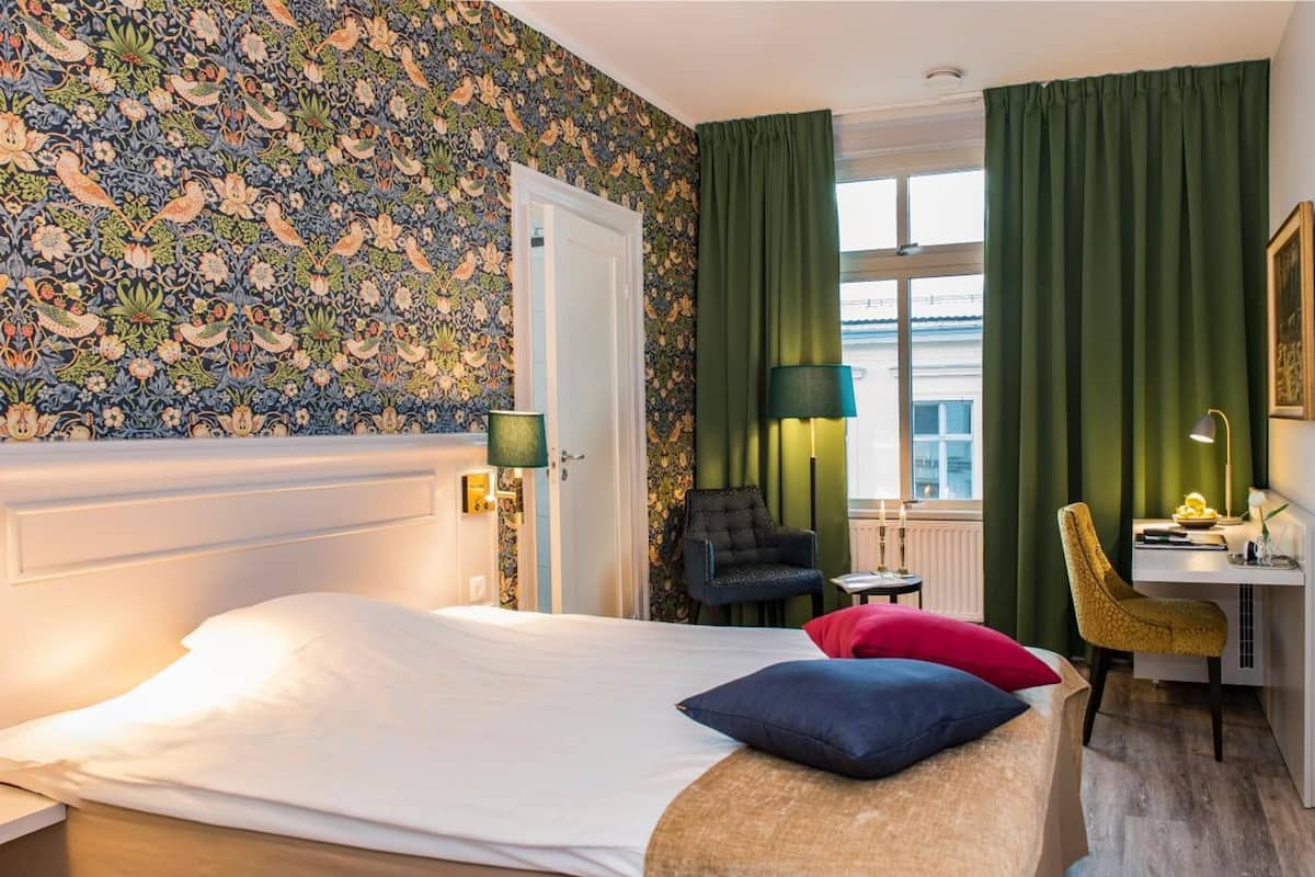 deluxe double room, 1 king bed with sofa bed | individually decorated, individually furnished, desk, blackout curtains