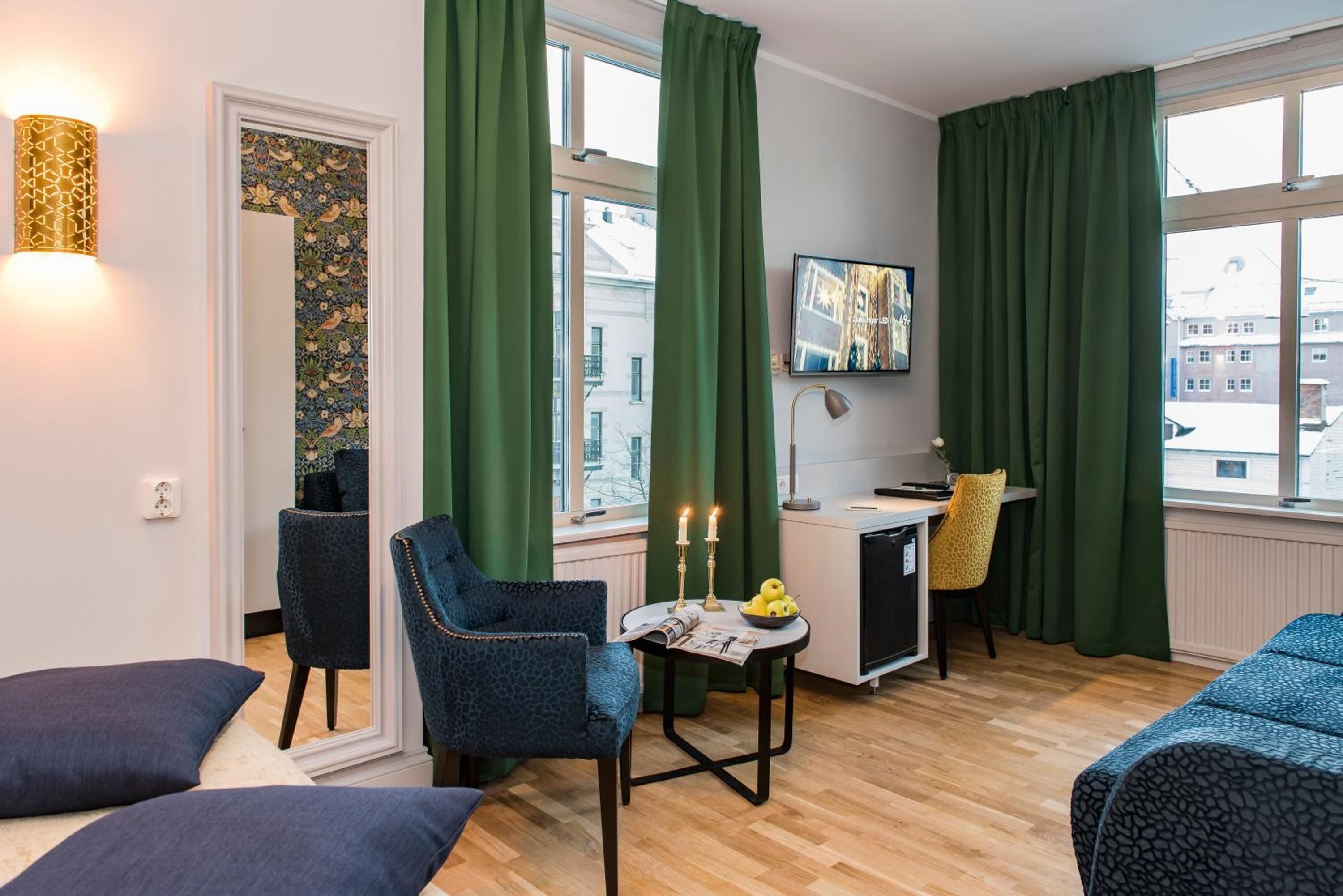 deluxe double room, 1 king bed with sofa bed | living room | flat-screen tv