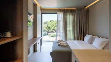 Deluxe Double Room, 1 King Bed, Partial Sea View, Beachfront | Minibar, in-room safe, desk, laptop workspace