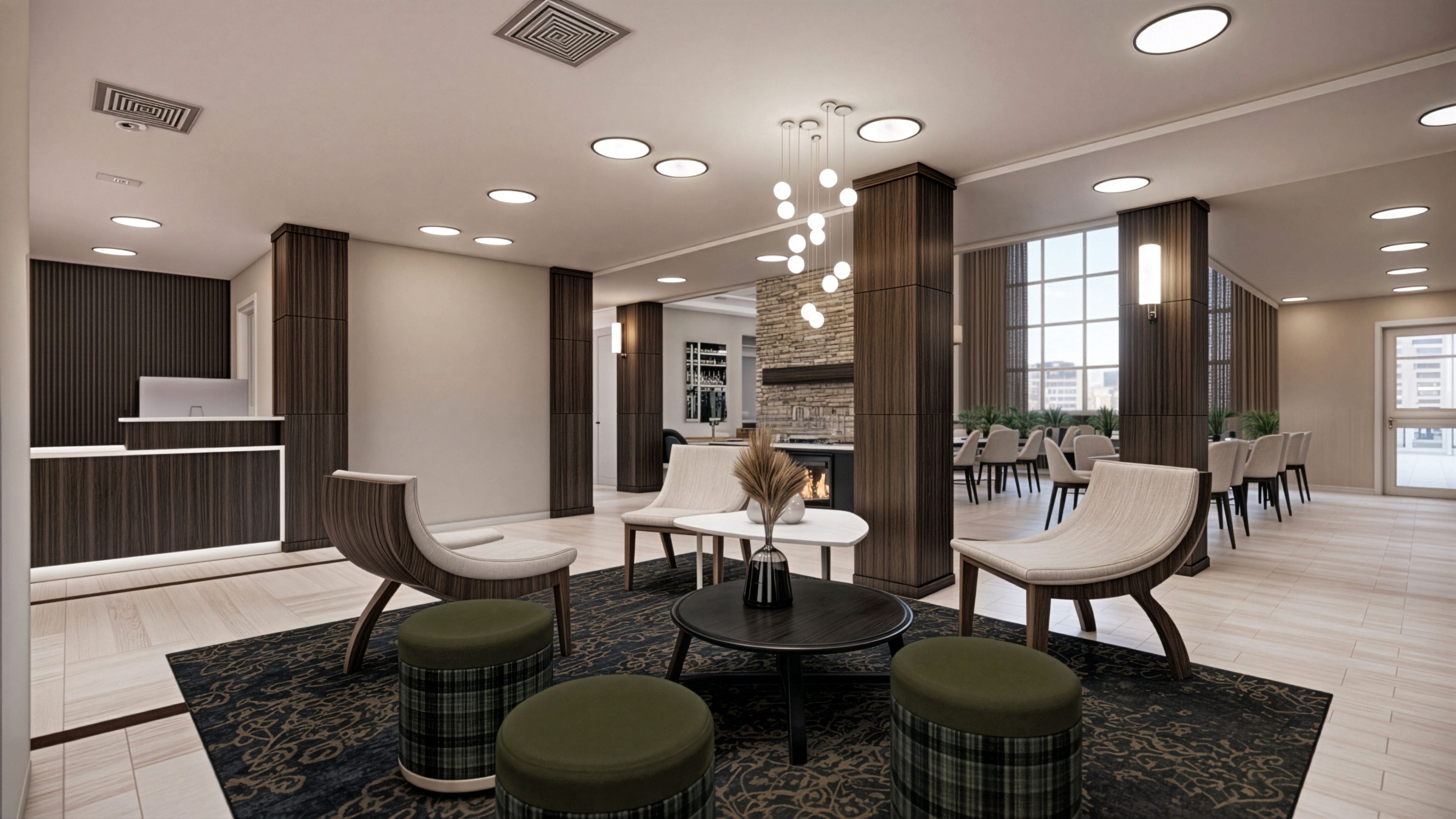 A modern lobby with seating, a reception desk, and a fireplace.