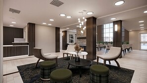 A modern lobby with seating, a reception desk, and a fireplace. - Residence Inn by Marriott Edmonton West (Edmonton)