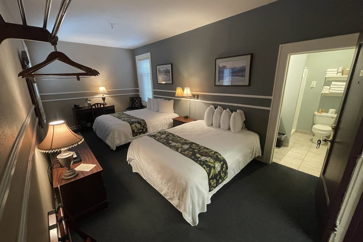 room, 2 queen beds | 1 bedroom, iron/ironing board, free wifi, bed sheets