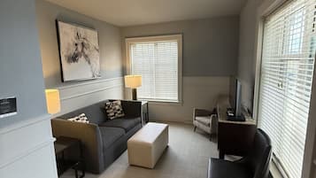 Executive Double Room | Living area | Flat-screen TV, printers