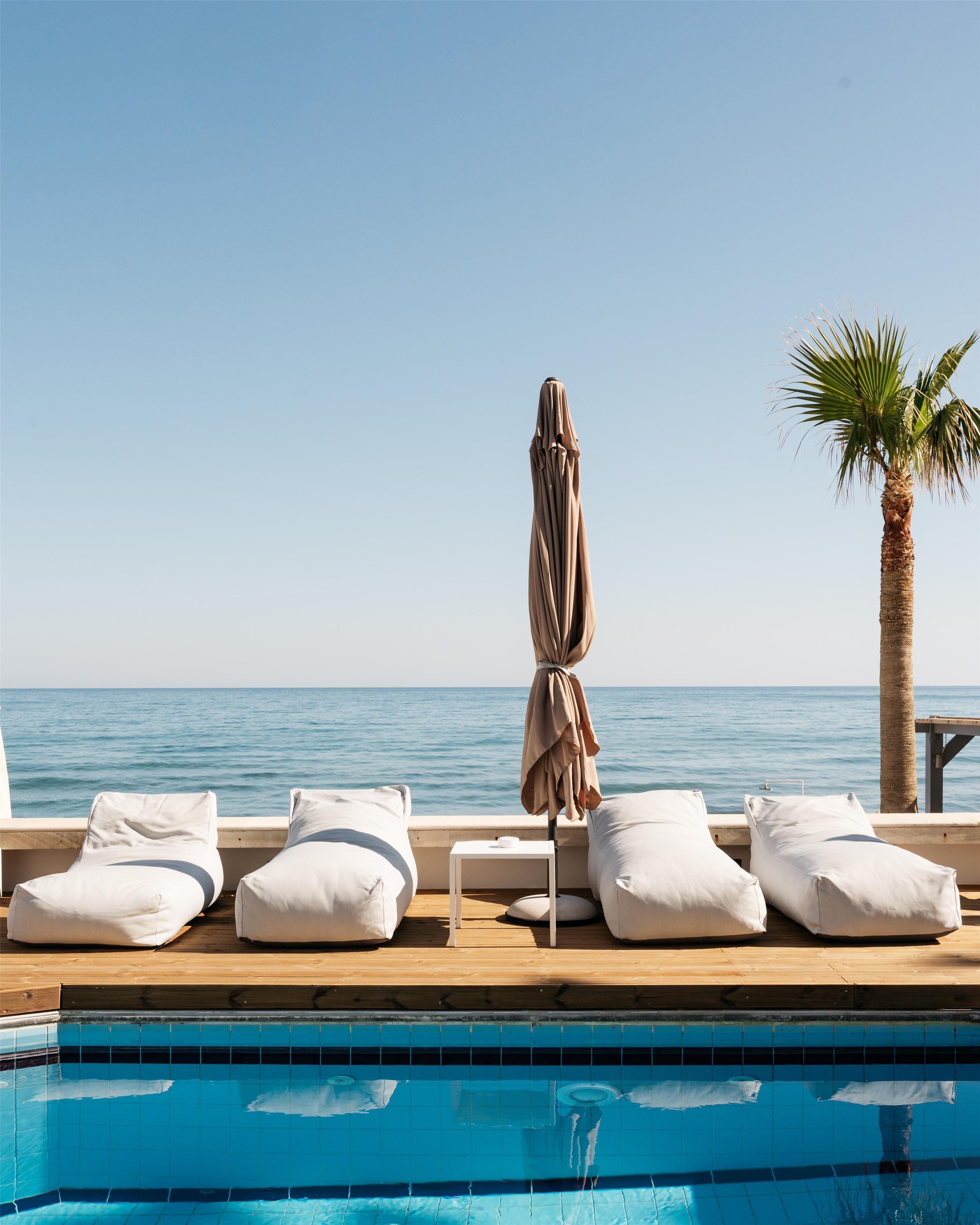Seasonal outdoor pool, pool umbrellas, pool loungers