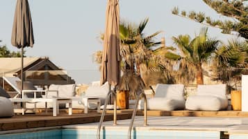 Seasonal outdoor pool, pool umbrellas, pool loungers