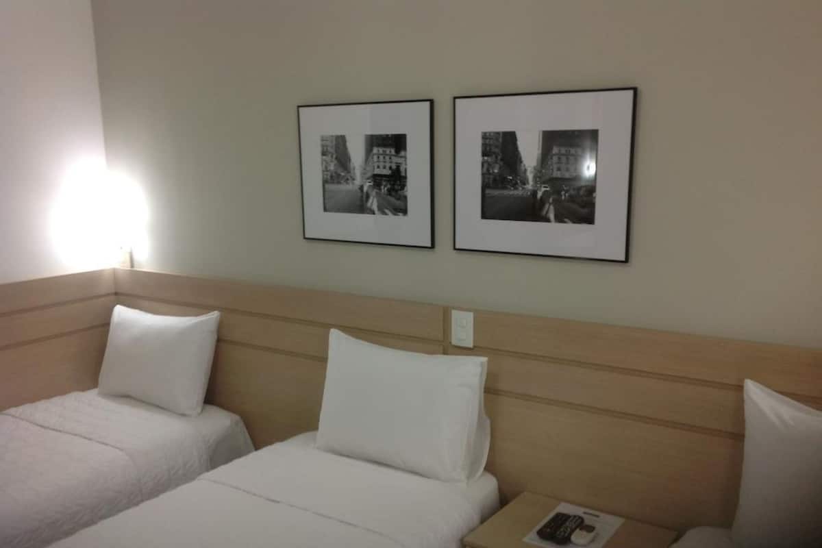 Triple Room | Minibar, desk, blackout curtains, iron/ironing board