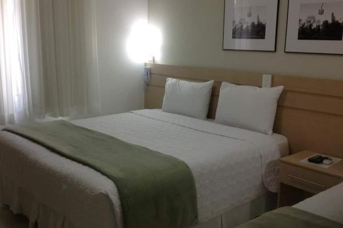 Minibar, desk, blackout curtains, iron/ironing board