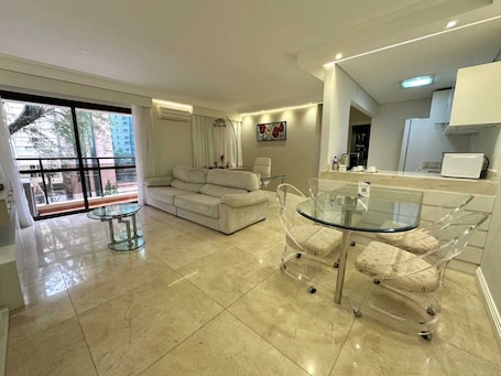 Premium Double Room Single Use, 1 Double Bed | Living area | TV