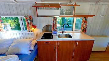 Mini-fridge, stovetop, cookware/dishes/utensils
