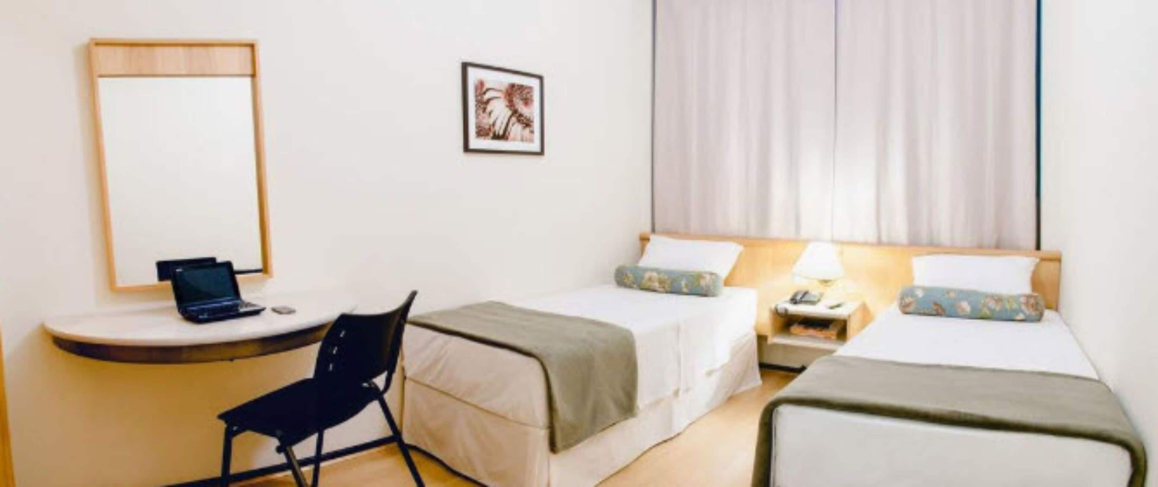 twin room | minibar, in-room safe, desk, blackout curtains