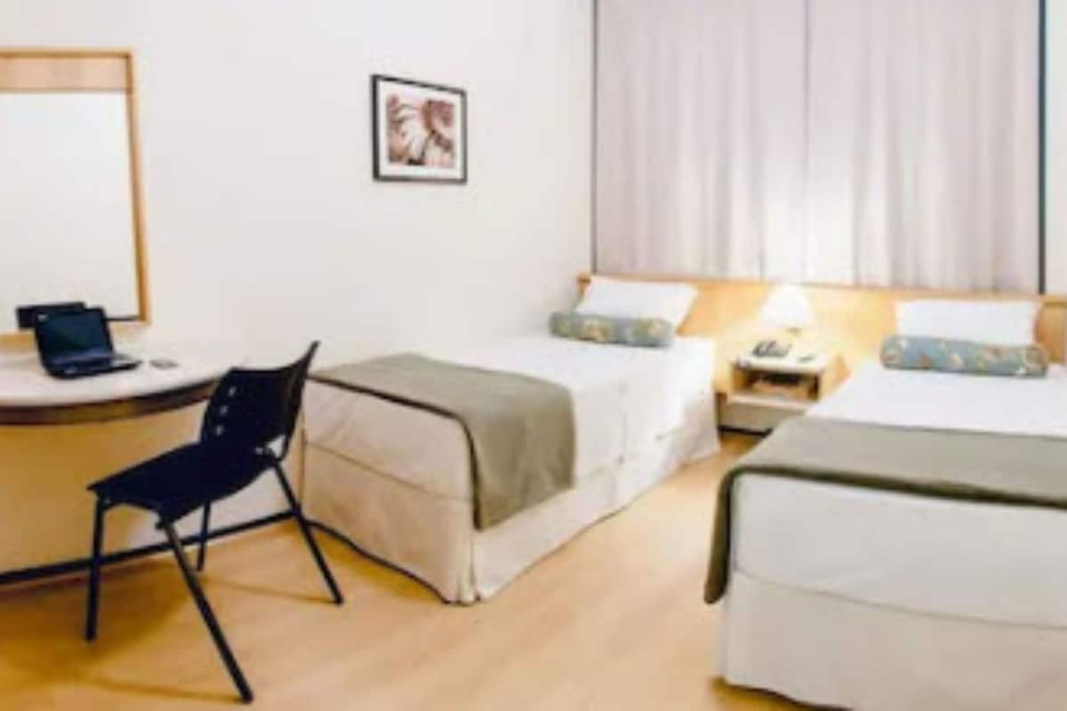 twin room | minibar, in-room safe, desk, blackout curtains