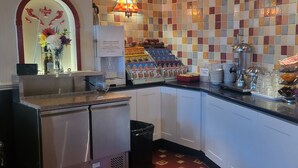 A breakfast bar with a variety of food items, a coffee machine, and a sign indicating gluten-free options. - Blenheim Mount Hotel (Blackpool)