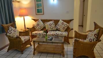 Suite, 2 Bedrooms | Living area | 24-inch TV with satellite channels