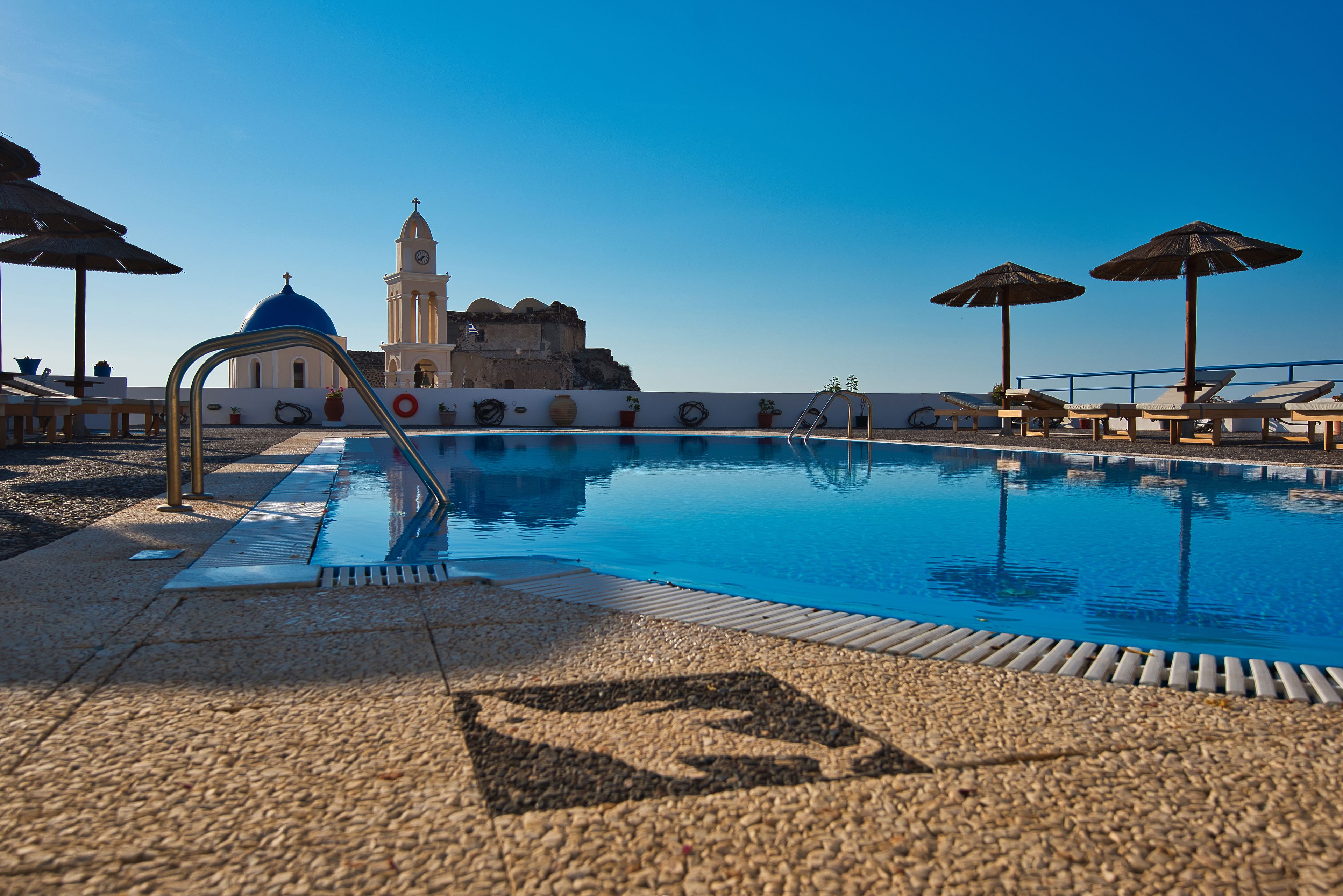 outdoor pool, open 8:00 am to 8:00 pm, pool umbrellas, pool loungers