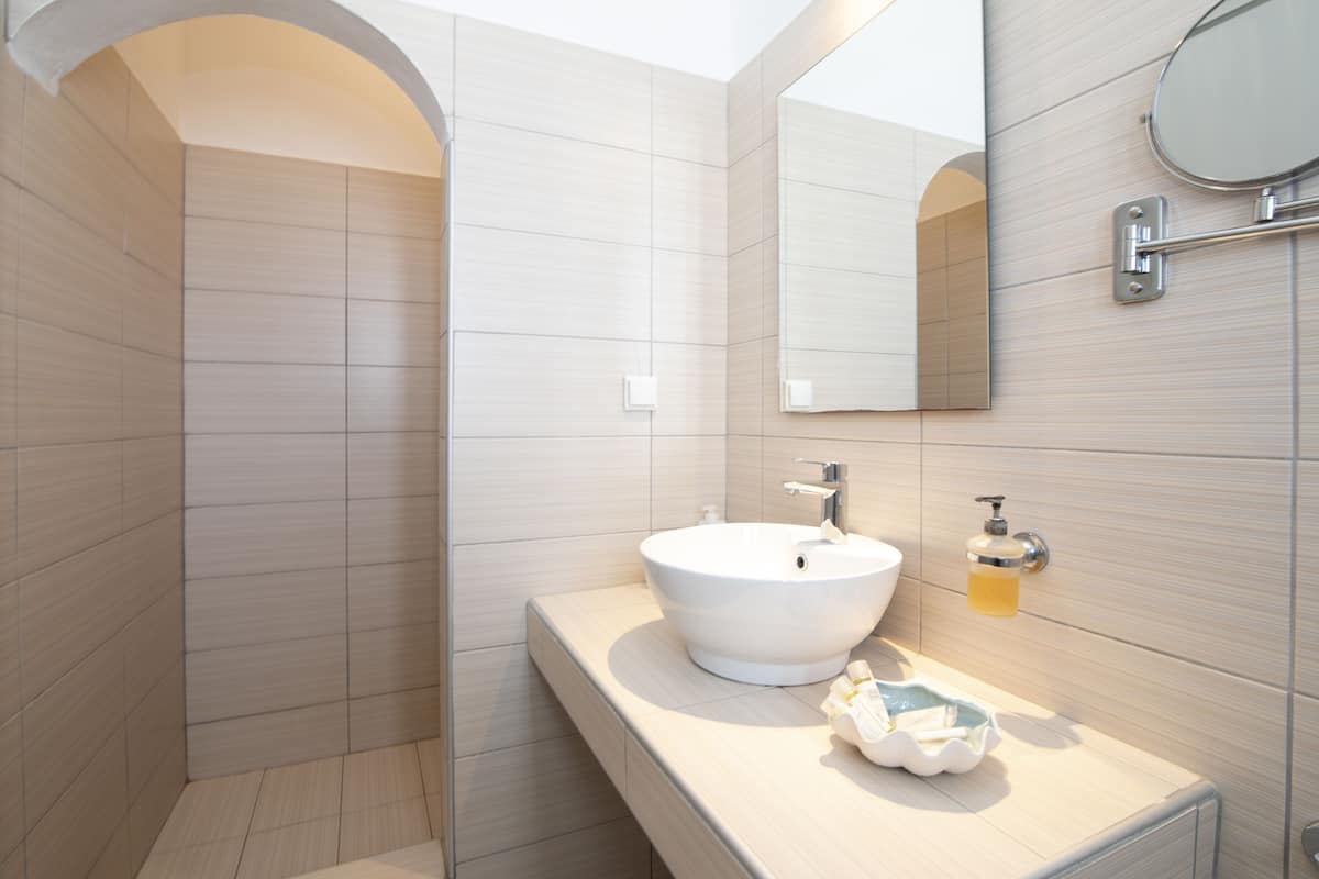 superior quadruple room | bathroom | shower, free toiletries, hair dryer, towels