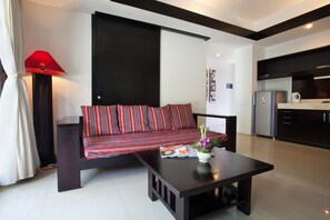 Departamento, 1 habitación | Área de sala de estar | Televisión LED y reproductor de DVD 