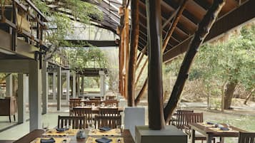 Breakfast, lunch, dinner served; Fusion cuisine, pool views