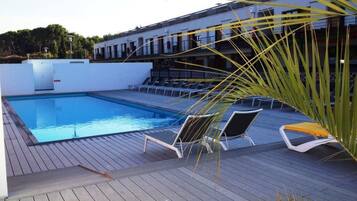 Outdoor pool, pool umbrellas, pool loungers