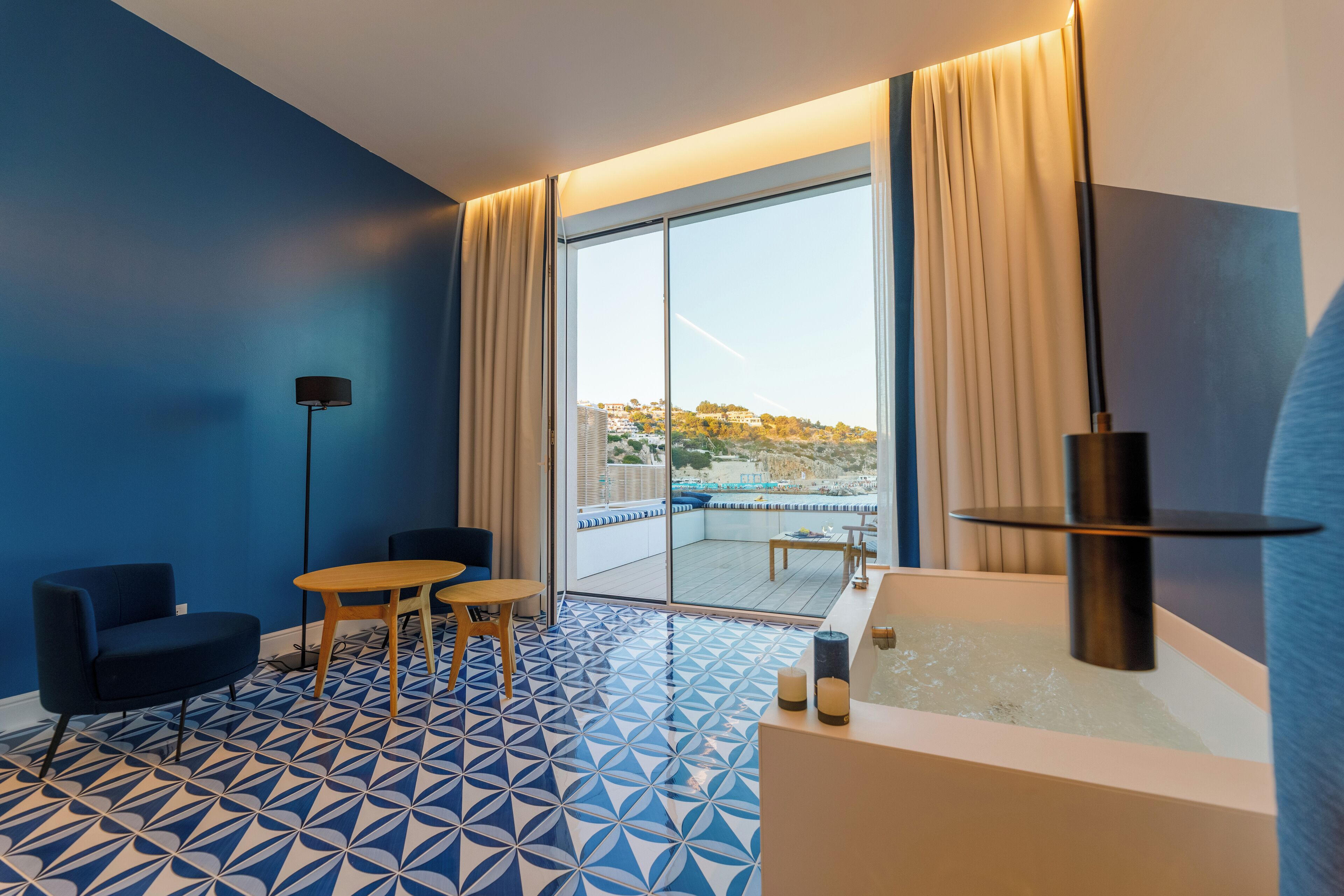panoramic suite, 1 queen bed, hot tub, sea view | 1 bedroom, premium bedding, minibar, in-room safe