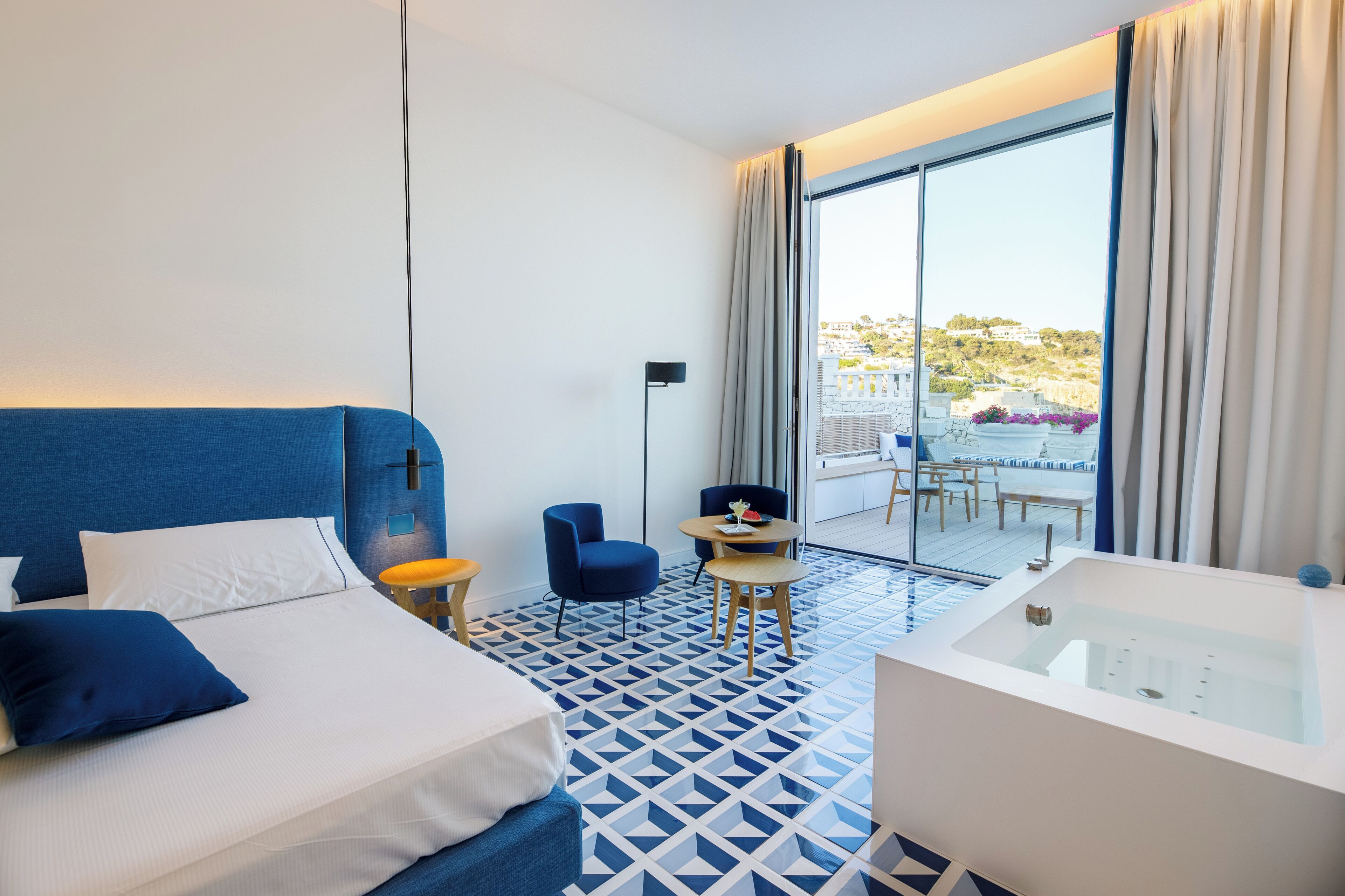 panoramic suite, 1 queen bed, hot tub, sea view | 1 bedroom, premium bedding, minibar, in-room safe