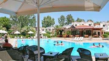 Seasonal outdoor pool, open 8:00 AM to 8:00 PM, pool umbrellas