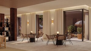 A modern hotel lobby with a spacious seating area, large windows, and a visible outdoor view. -  The Lince Ecorkhotel Évora (Évora)