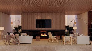 A modern living room with a fireplace, a sofa, two armchairs, and a coffee table. -  The Lince Ecorkhotel Évora (Évora)