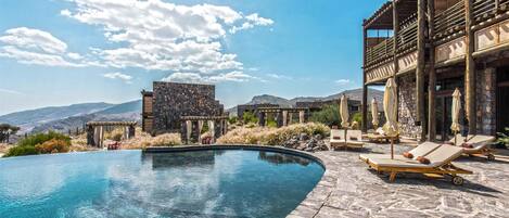 Indoor pool, outdoor pool, free pool cabanas, pool umbrellas