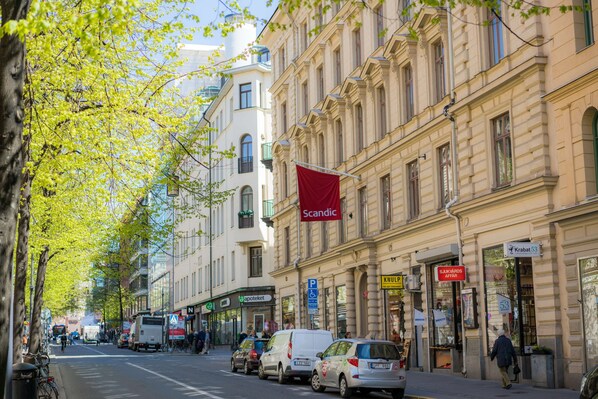 A street lined with buildings, including a pharmacy and a bank. - Scandic No 53 (Stockholm)