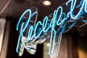 A neon sign with the word "Reception" in a stylized font. - Scandic No 53 (Stockholm)