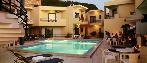Outdoor pool, open 9:00 AM to 9:30 PM, pool umbrellas, pool loungers