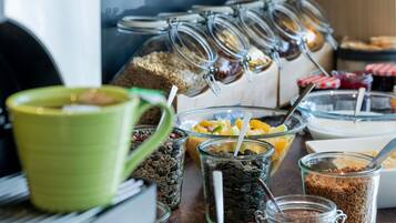 A breakfast buffet with various food items and containers.