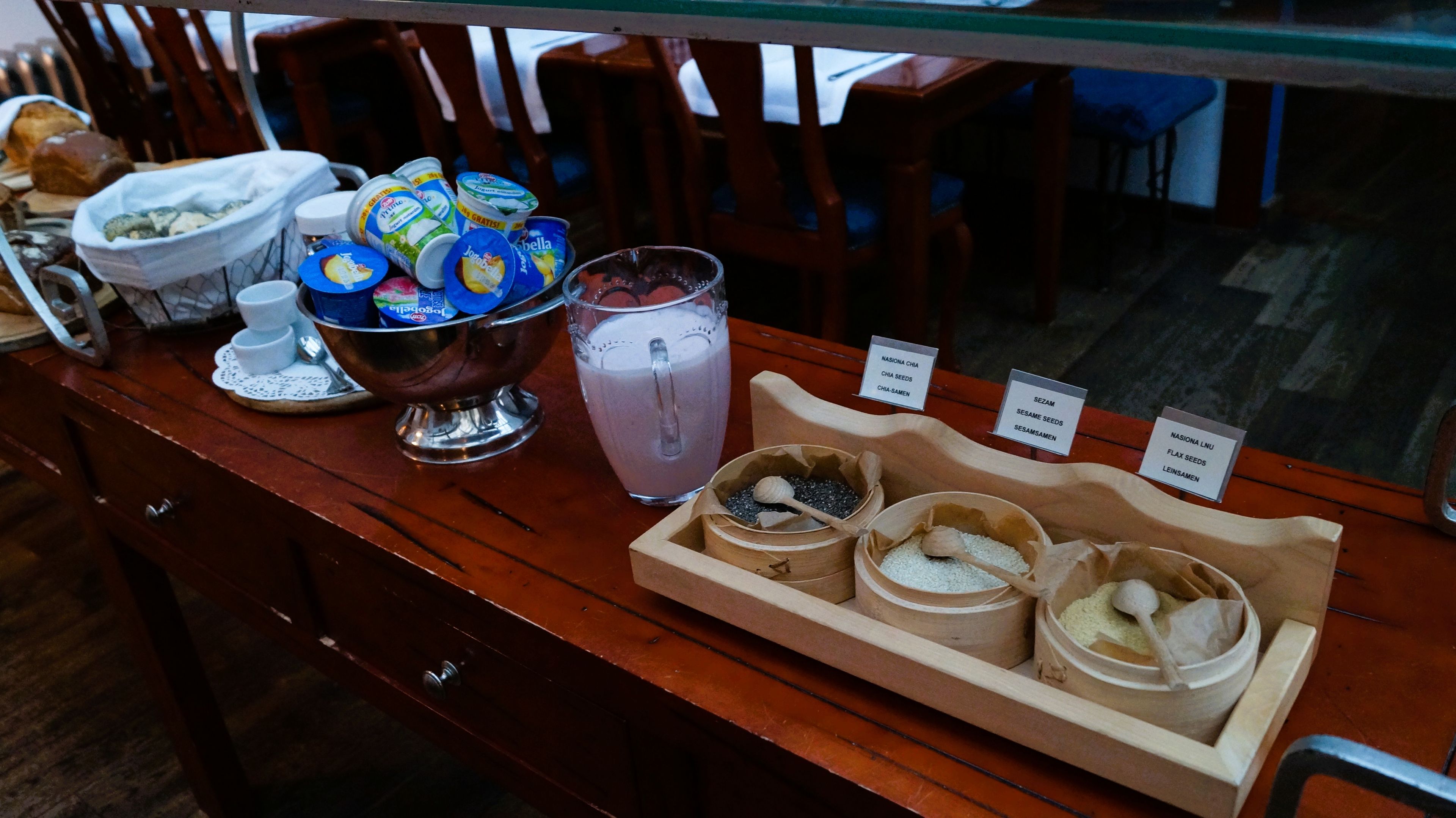 A buffet table with various food items and containers.
