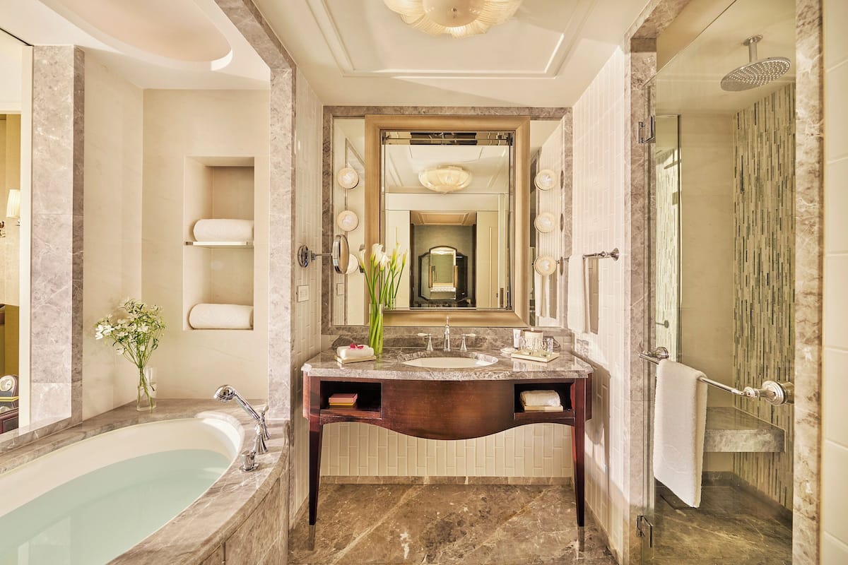 separate bathtub and shower, deep-soaking bathtub, designer toiletries