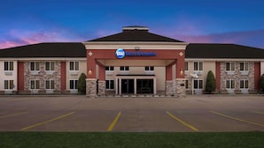 A Best Western hotel with a central entrance, multiple windows, and a parking lot. - Best Western Kenosha Inn (Broken Arrow)