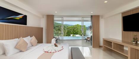 A modern hotel room with a large bed, a flat-screen TV, a balcony with a pool view, and a wooden headboard.