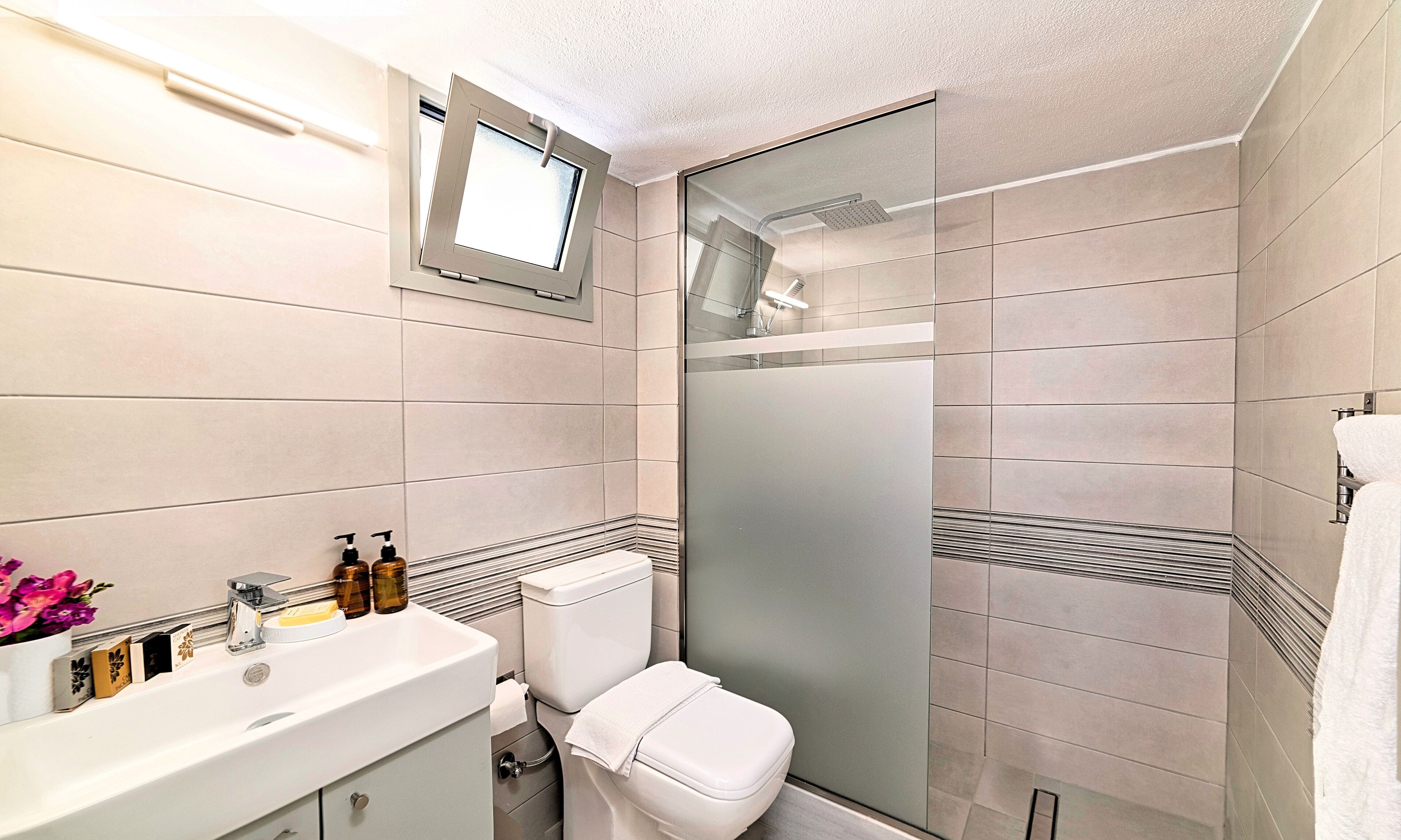 shower, rainfall showerhead, designer toiletries, hair dryer