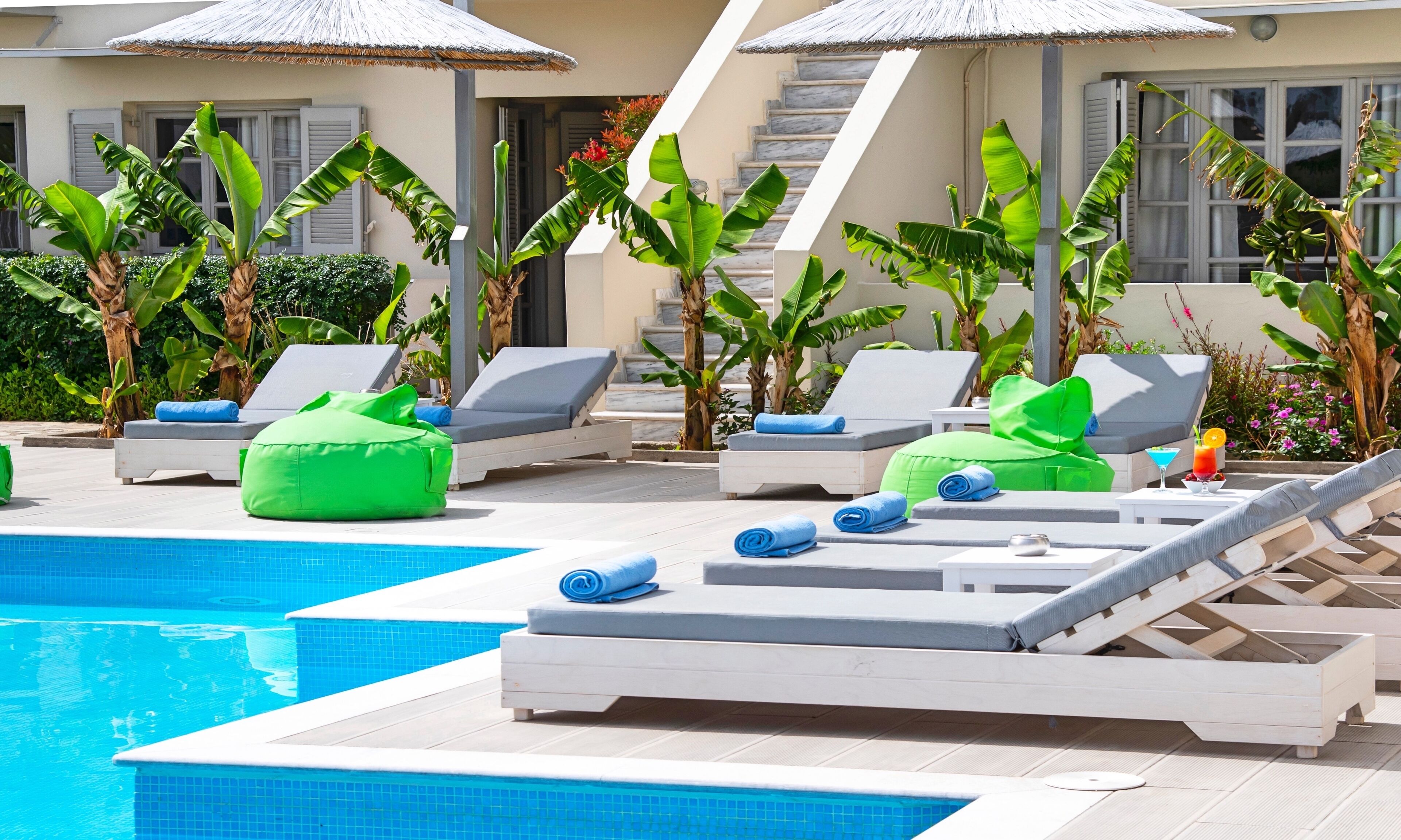 outdoor pool, pool umbrellas, pool loungers