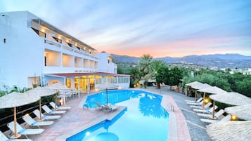 Outdoor pool, open 10:30 AM to 6:00 PM, pool umbrellas, pool loungers