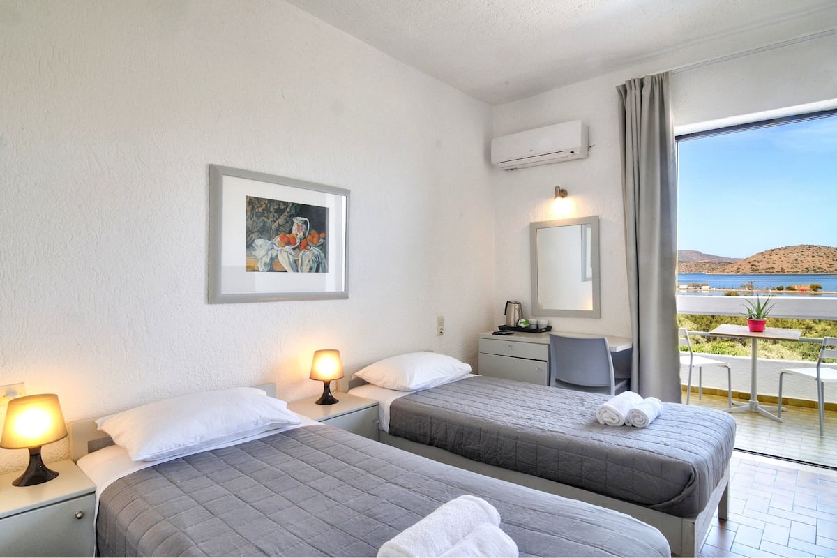 Classic Room, Partial Sea View | Desk, iron/ironing board (on request), WiFi (free), bed sheets