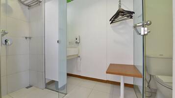 Shower, rainfall showerhead, slippers, towels