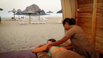 Relax with a soothing massage overlooking the ocean and enjoy the tranquil beach atmosphere.