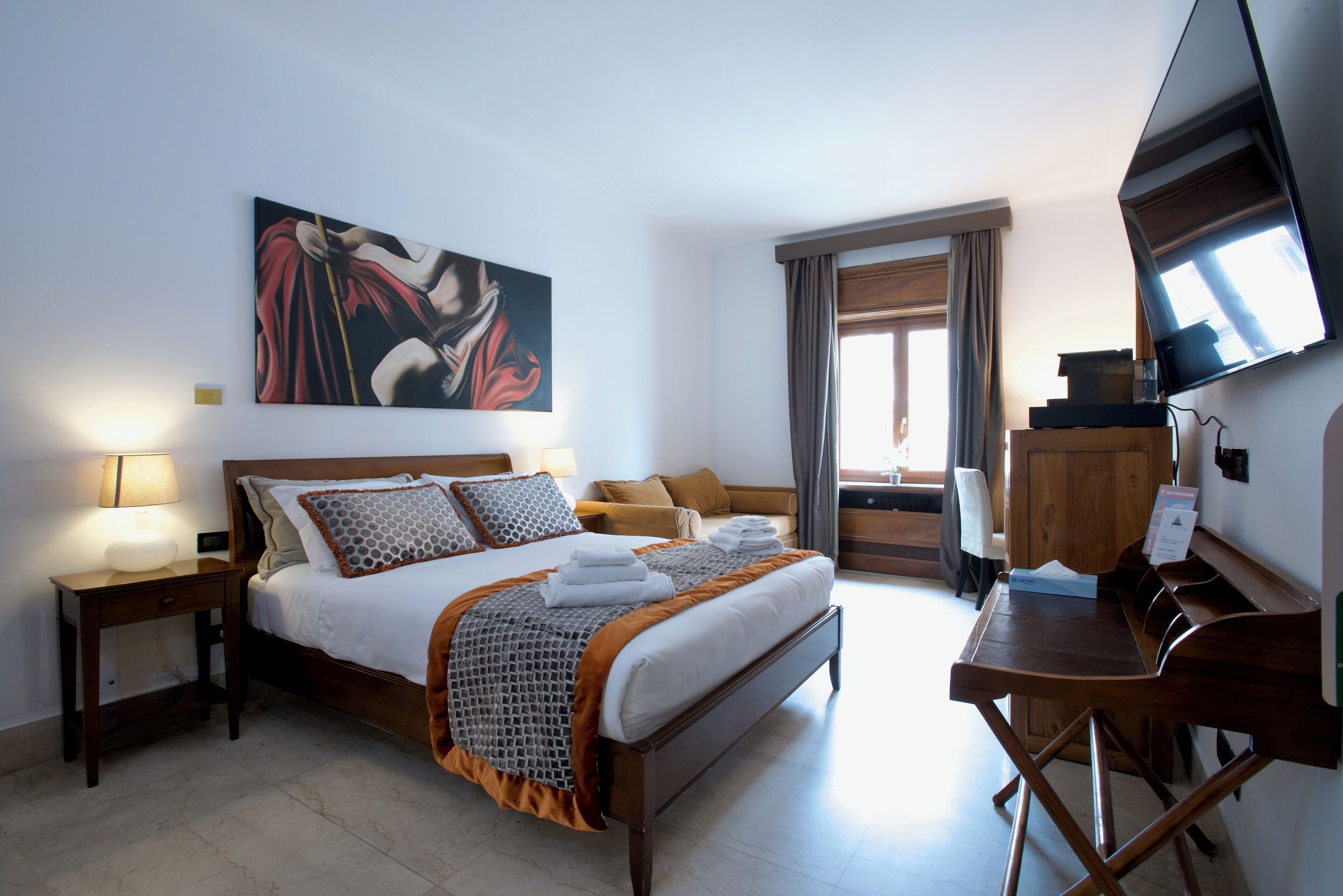 Triple Room | Minibar, in-room safe, desk, blackout curtains