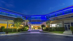 A hotel with a modern design, featuring a central entrance with a staircase leading to the lobby. - Cathrin Hotel Rhodes By Anayia All Inclusive Resorts (Rhodes)
