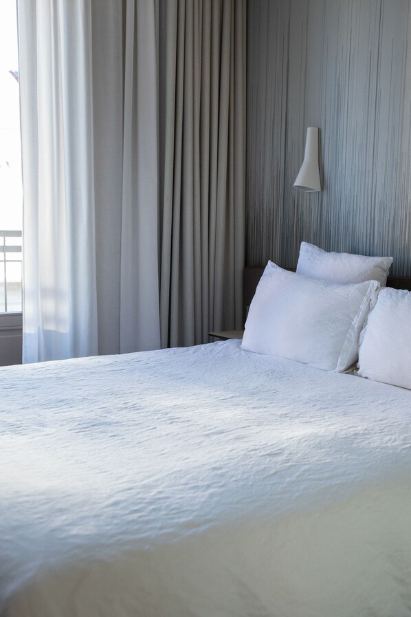 Premium bedding, down duvets, in-room safe, desk